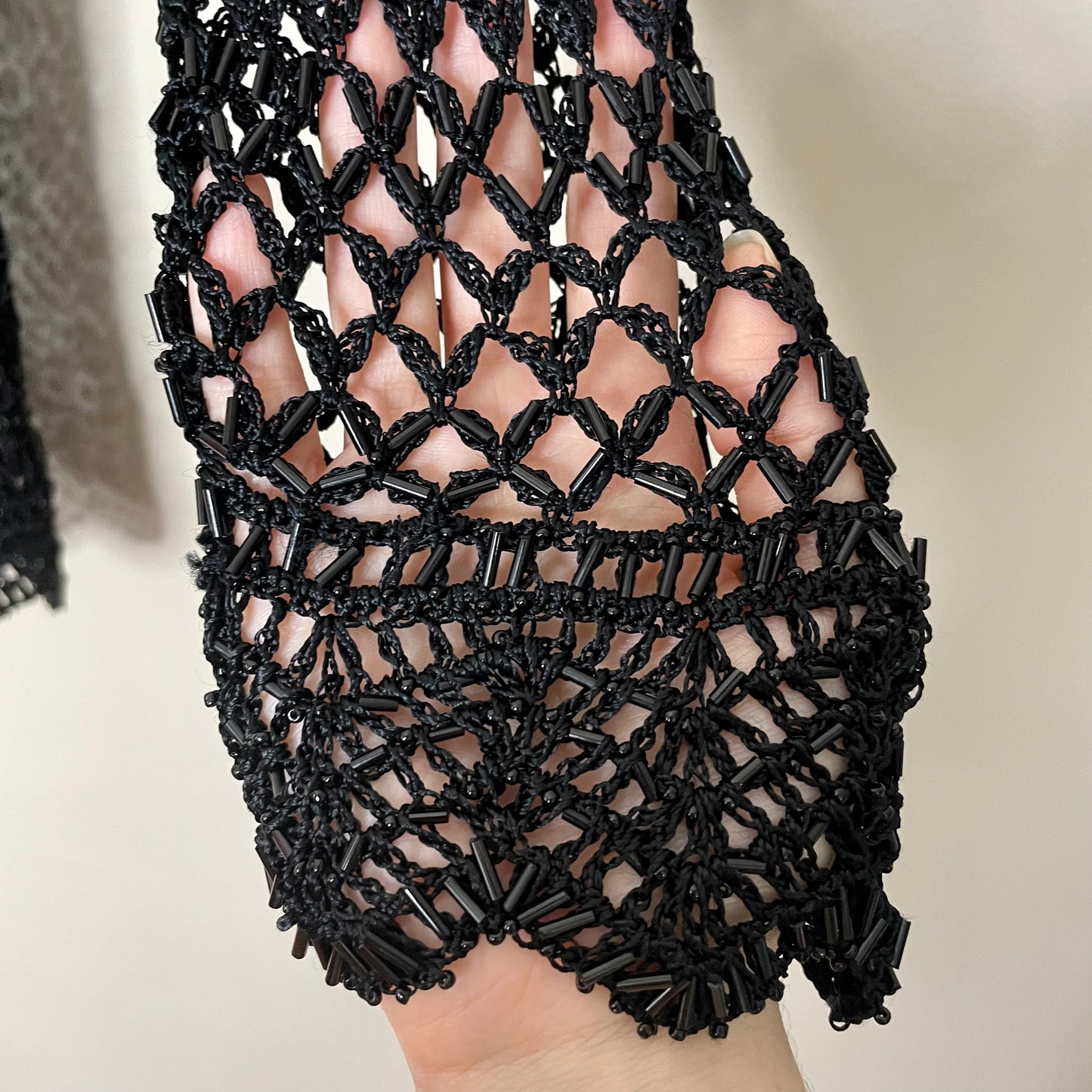 expensive black beaded babydoll sweater M